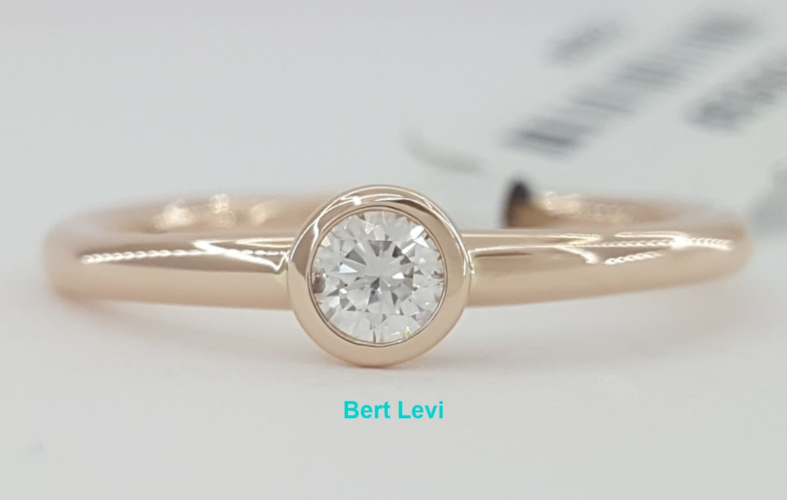 0.21 ct 14K Rose Gold Bezel Set Round Cut Diamond Solitaire Engagement Ring